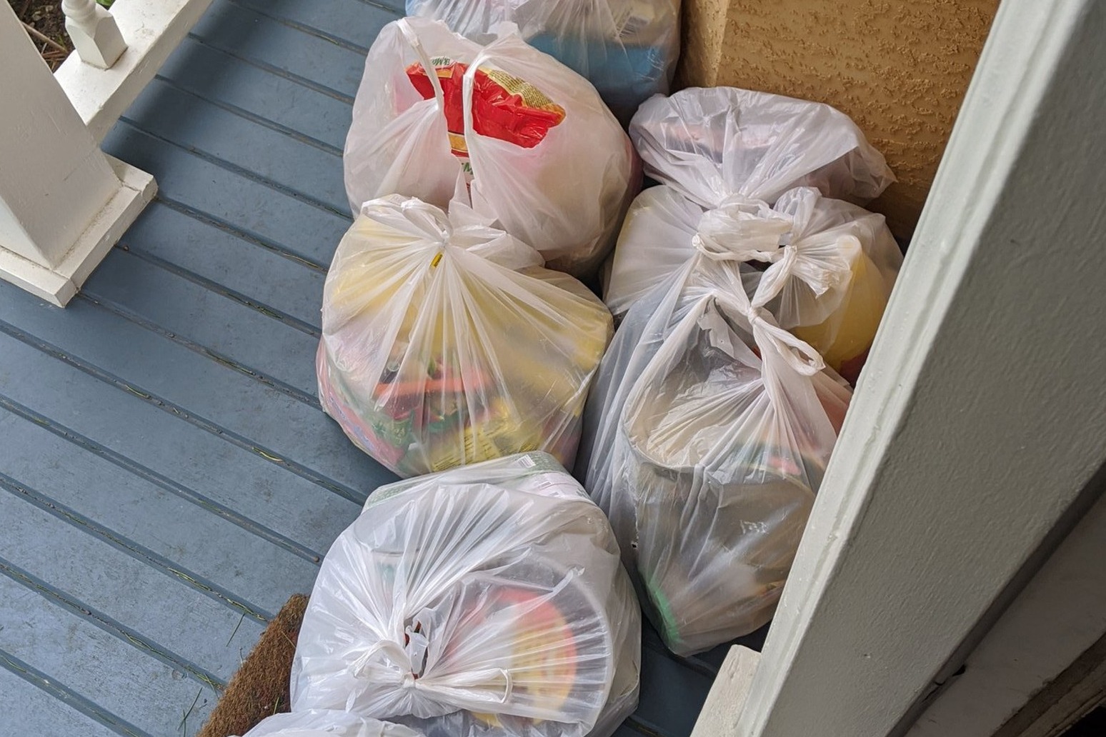 Refugee family brings food to self-isolating family who sponsored their move